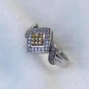 Sterling silver ring with tiny yellow diamonds. Total weight is 2.97 grams